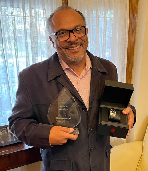 Pierre Laurent recognizes 2021 Visionary Award winner Alfons Adetuyi at Reelworld